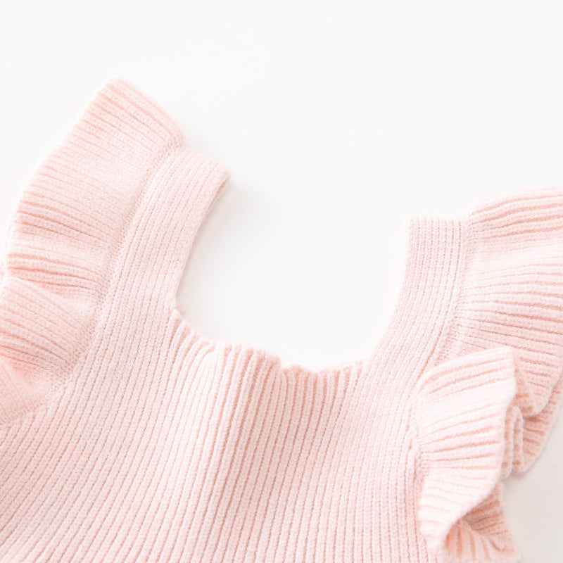Close-up of a pink knitted sweater on a white background