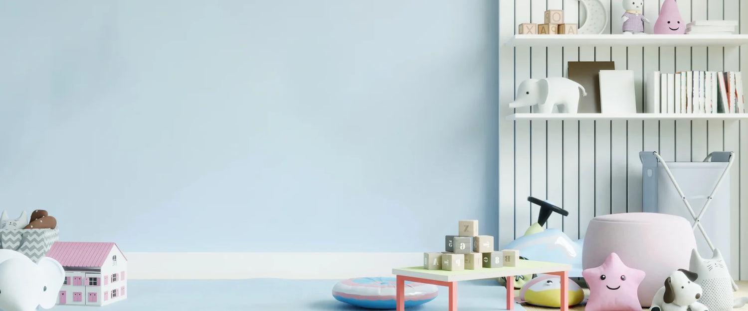 Children's room with a blue wall, white shelves, and various toys and decor items.